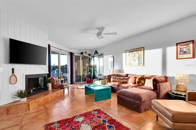 a living room with fireplace furniture and a flat screen tv