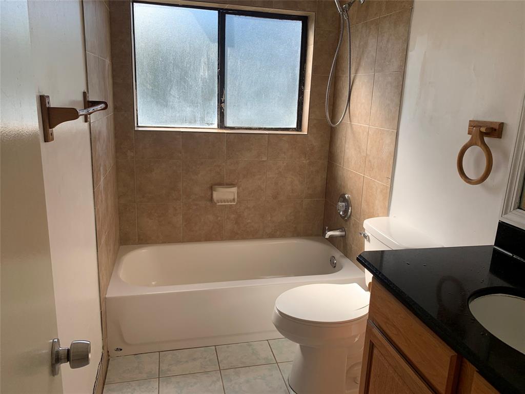 10850 Royal Palm Boulevard, Unit 10850 Coral Springs, FL 33065 - Photo 7 of 8 a white bath tub sitting next to a white toilet
