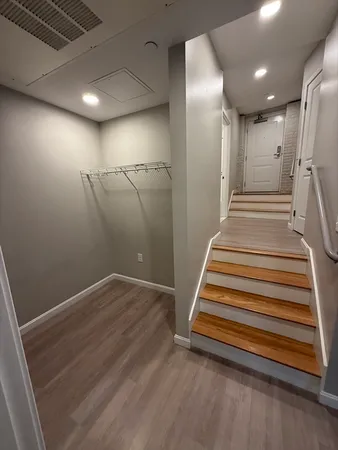 a view of a hallway with stairs