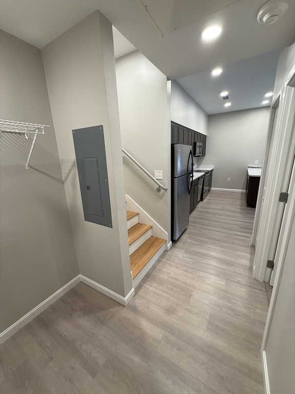 6 Chatham Street, Unit 308 Worcester, MA 01609 - Photo 6 of 10 a view of a hallway with stairs