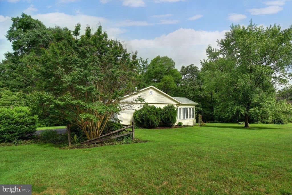 79 Otter Point Road Elkton, MD 21921 - Photo 4 of 22 Side view catches a glimpse of trees/vegetation