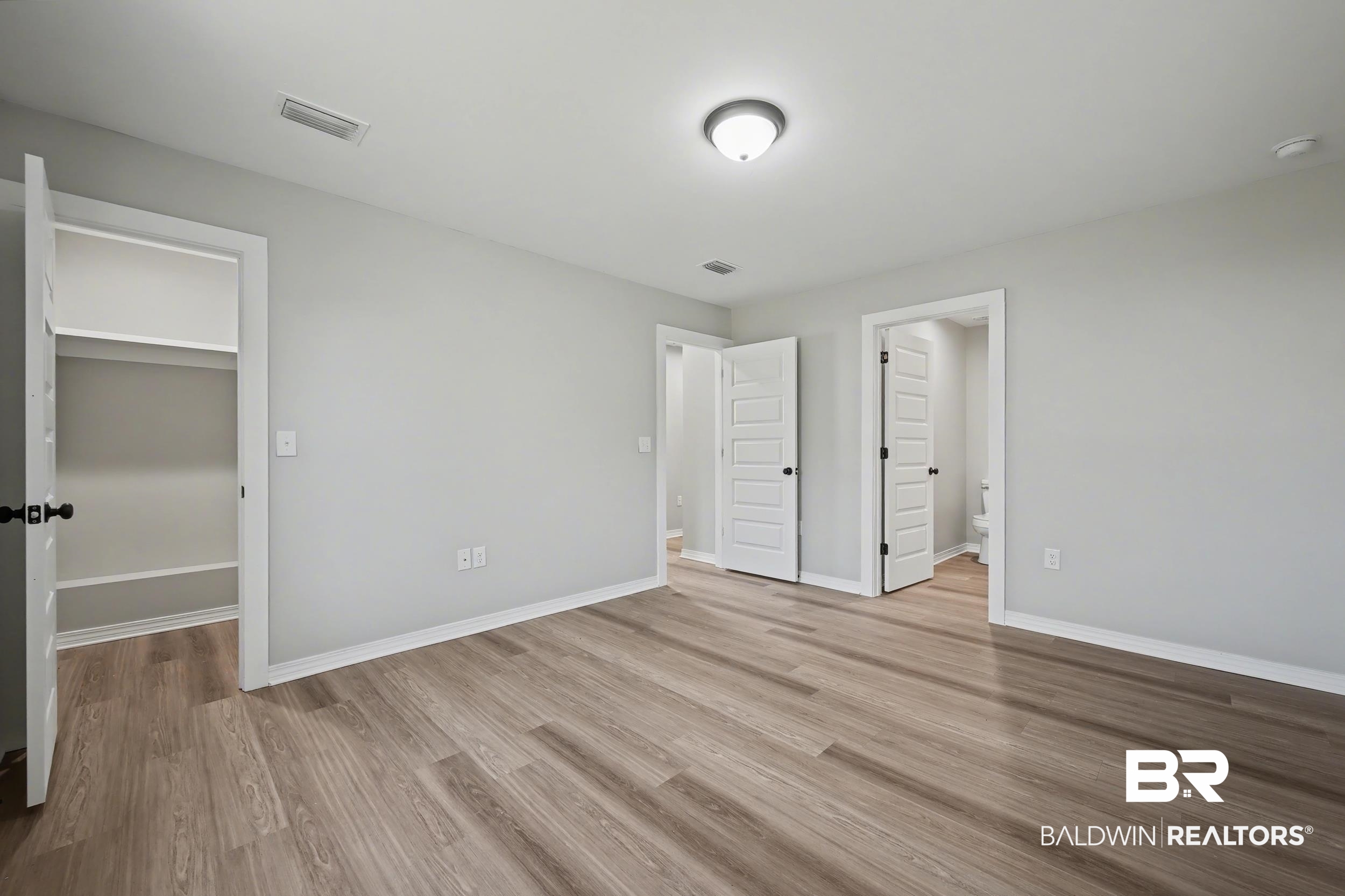 76 Fincher Lane Loxley, AL 36551 - Photo 18 of 33 Unfurnished bedroom with light wood finished floors and baseboards