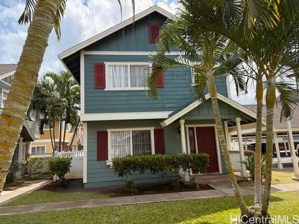a front view of a house with yard