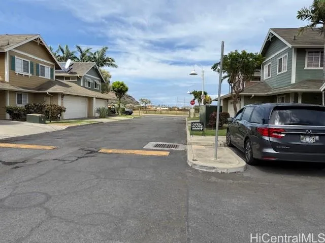 a view of a car parked in front of a house