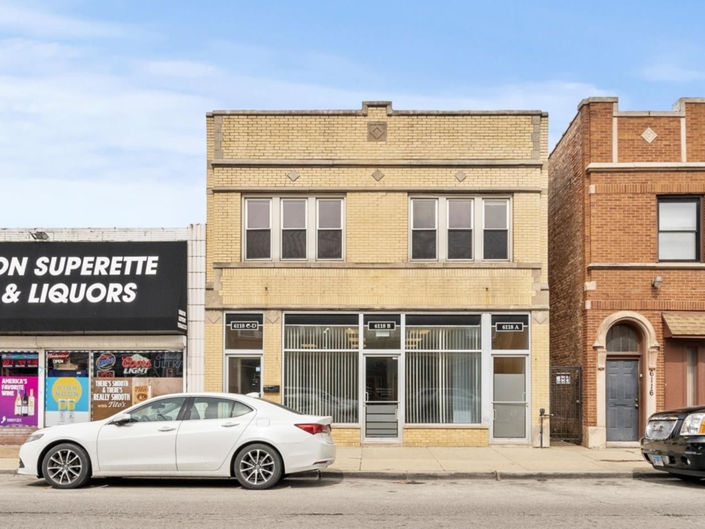 6118 West Addison Street Chicago, IL 60634 - Photo 1 of 35 a car parked in front of a building