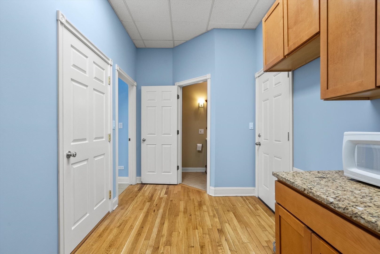 6118 West Addison Street Chicago, IL 60634 - Photo 13 of 35 a bathroom with a granite countertop sink and a mirror