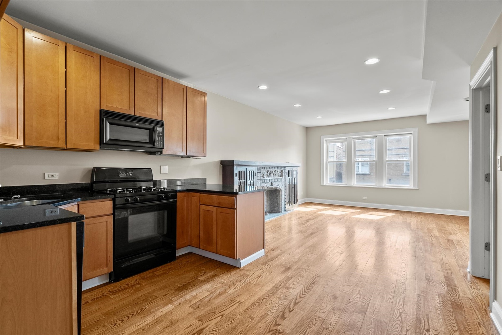 6118 West Addison Street Chicago, IL 60634 - Photo 20 of 35 a kitchen with stainless steel appliances granite countertop a stove a sink and a refrigerator