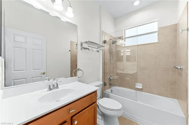 a bathroom with a sink a toilet and a bathtub