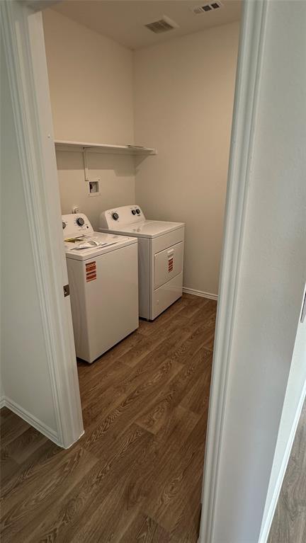 204 Inks Lane Kyle, TX 78640 - Photo 7 of 25 Efficient laundry room with durable wood flooring for easy care.