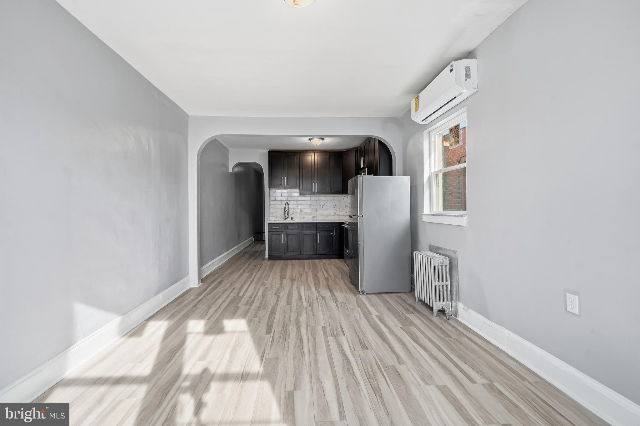 1938 Mifflin Street Philadelphia, PA 19145 - Photo 3 of 11 a view of kitchen and hallway with wooden floor