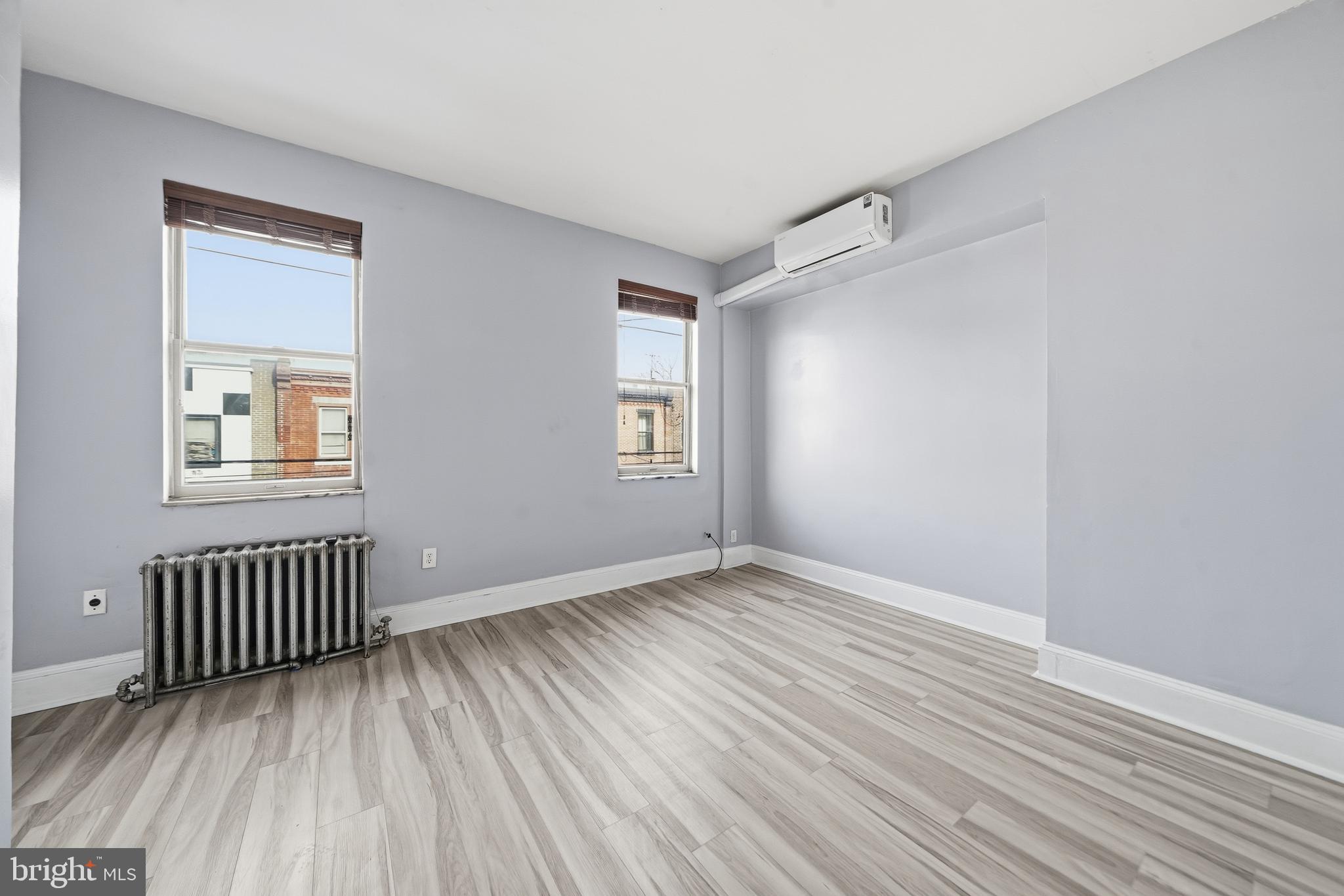 1938 Mifflin Street Philadelphia, PA 19145 - Photo 6 of 11 an empty room with windows
