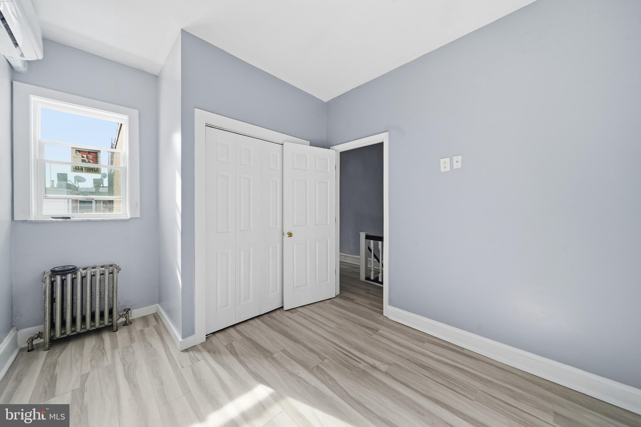1938 Mifflin Street Philadelphia, PA 19145 - Photo 9 of 11 a view of wooden floor and windows in a room