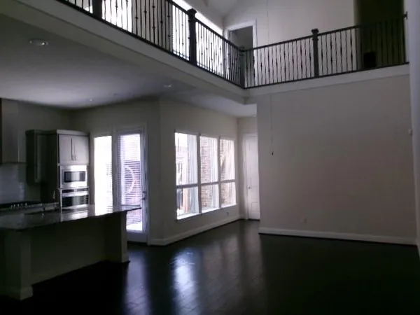 a view of a livingroom with wooden floor