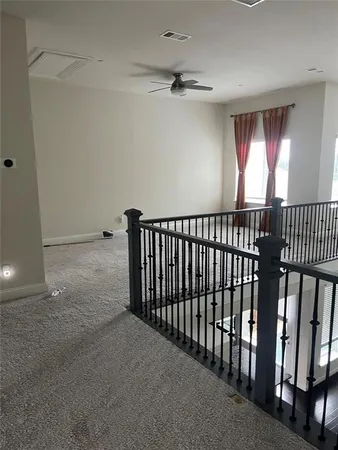a view of an entryway wooden floor and windows