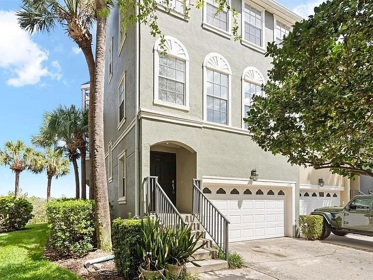 1450 Harbour Walk Road Tampa, FL 33602 - Photo 1 of 26 a front view of a house with a garden