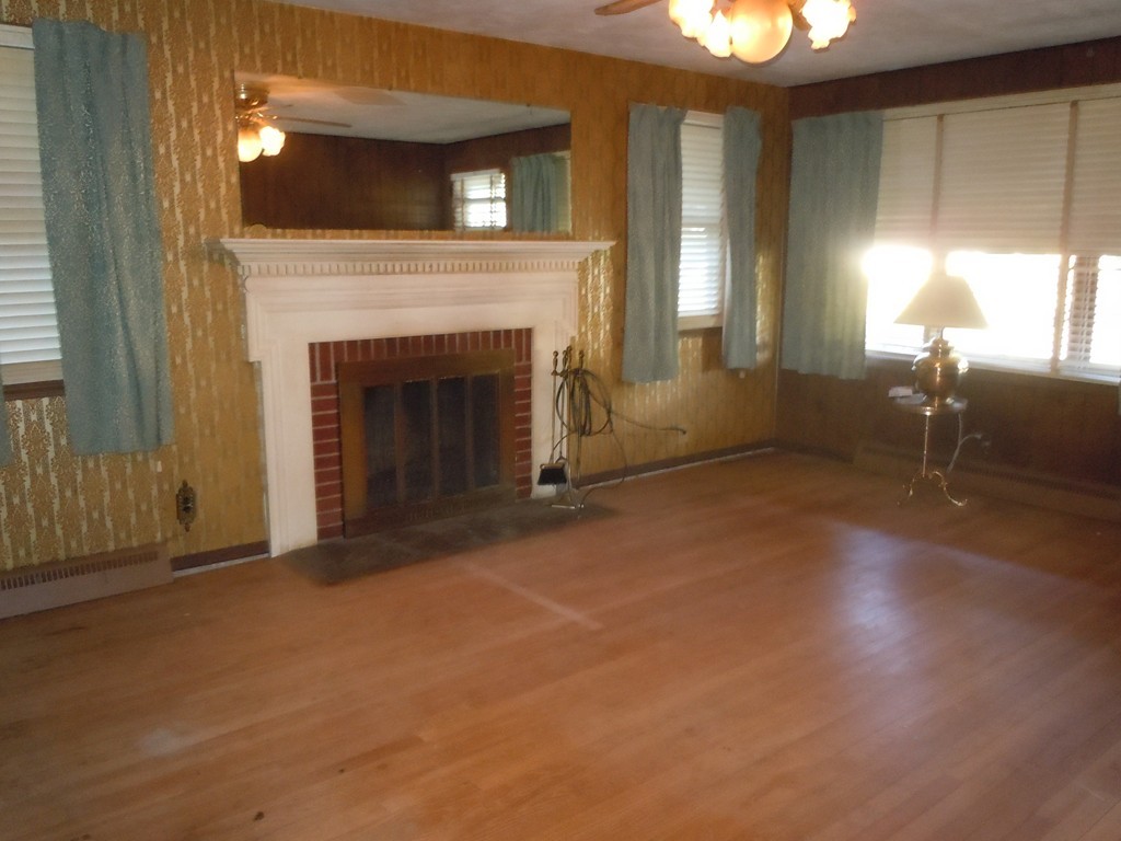 56 East Allen Ridge Road Springfield, MA 01118 - Photo 3 of 13 a view of a livingroom with a fireplace and window