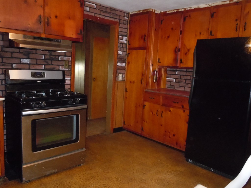 56 East Allen Ridge Road Springfield, MA 01118 - Photo 4 of 13 a kitchen with stainless steel appliances a stove and a refrigerator