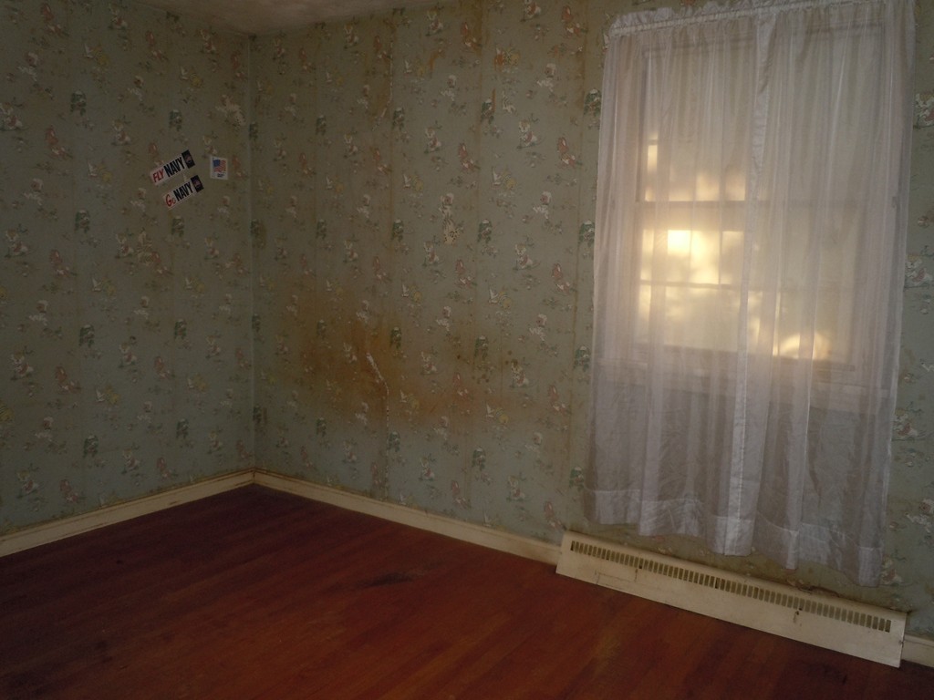 56 East Allen Ridge Road Springfield, MA 01118 - Photo 8 of 13 a empty room with a wooden door