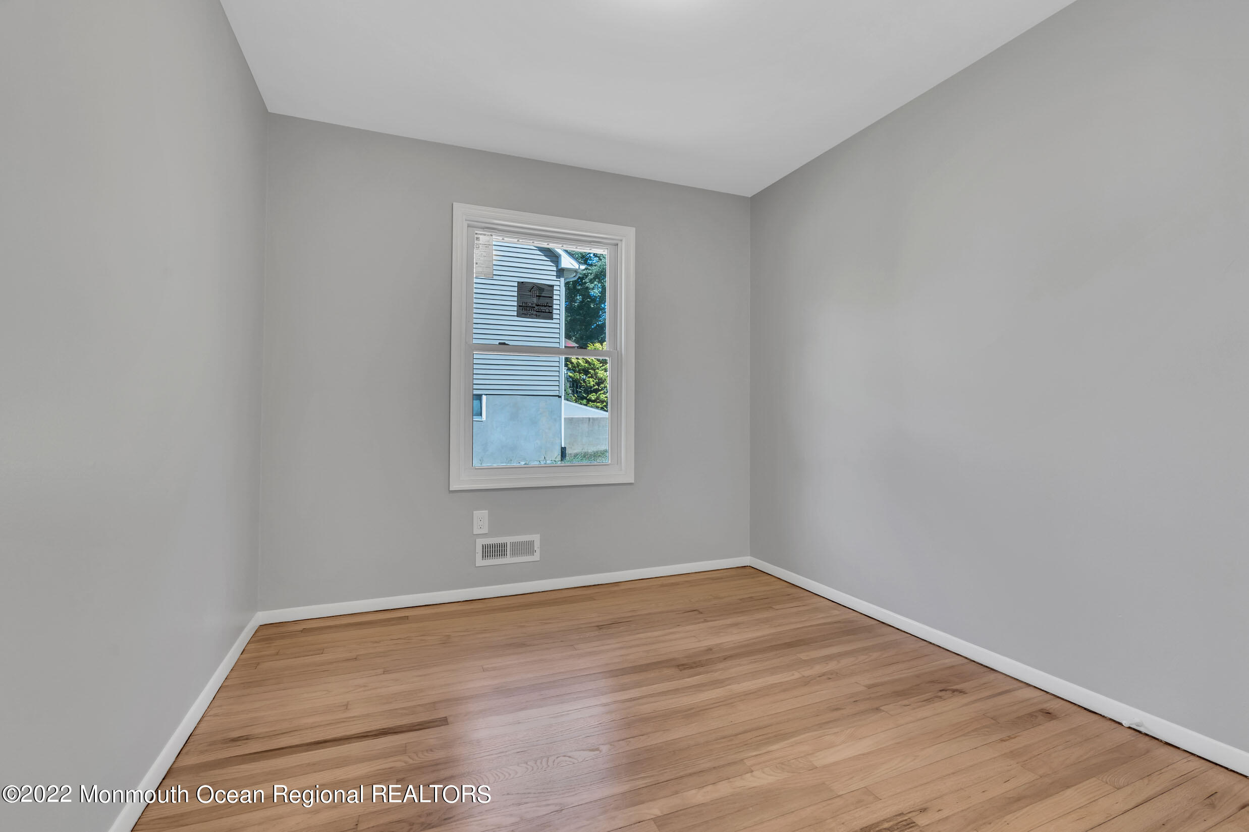 115 West 5th Street Howell, NJ 07731 - Photo 12 of 28 a view of empty room with wooden floor and fan
