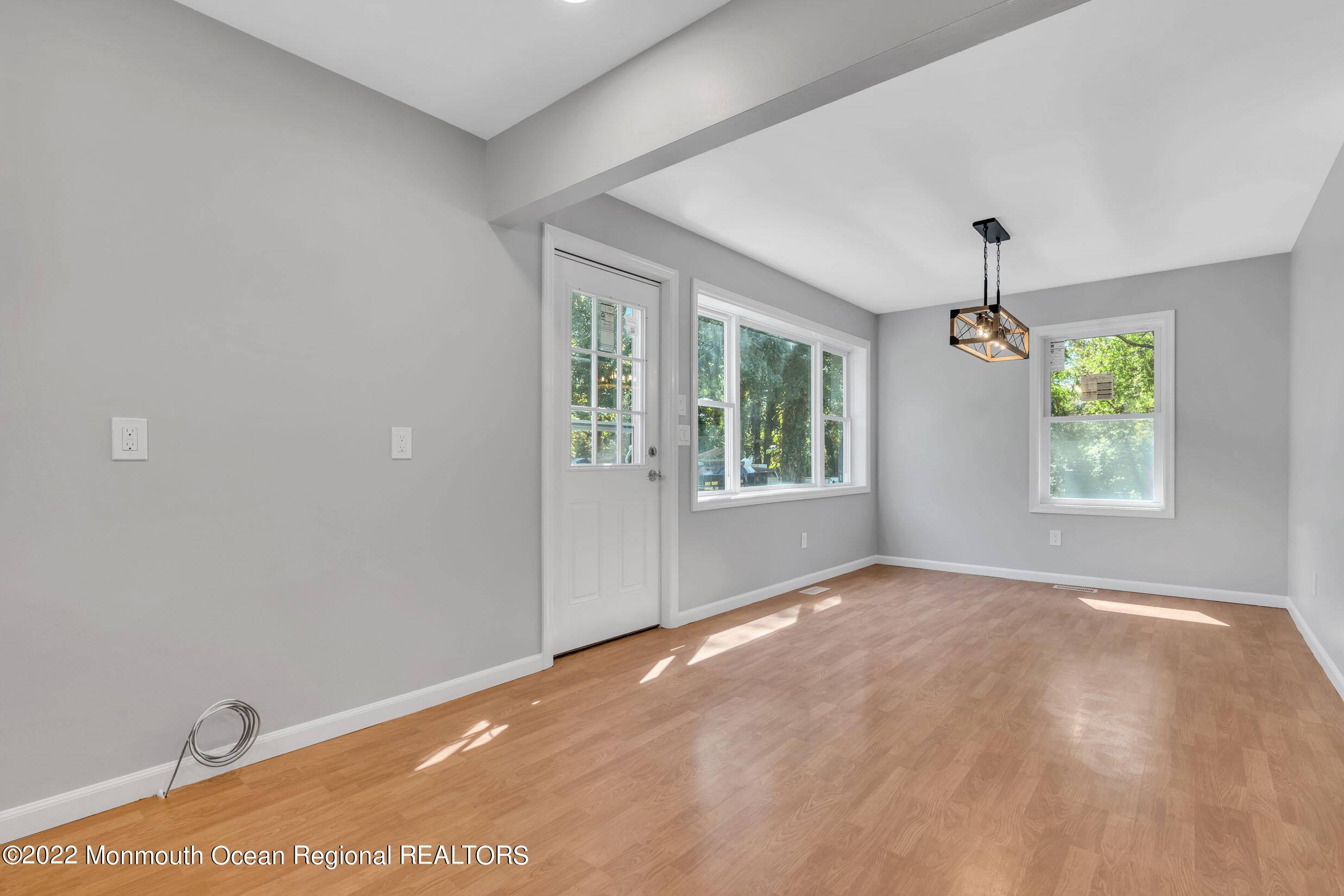 115 West 5th Street Howell, NJ 07731 - Photo 22 of 28 an empty room with windows and ceiling fan