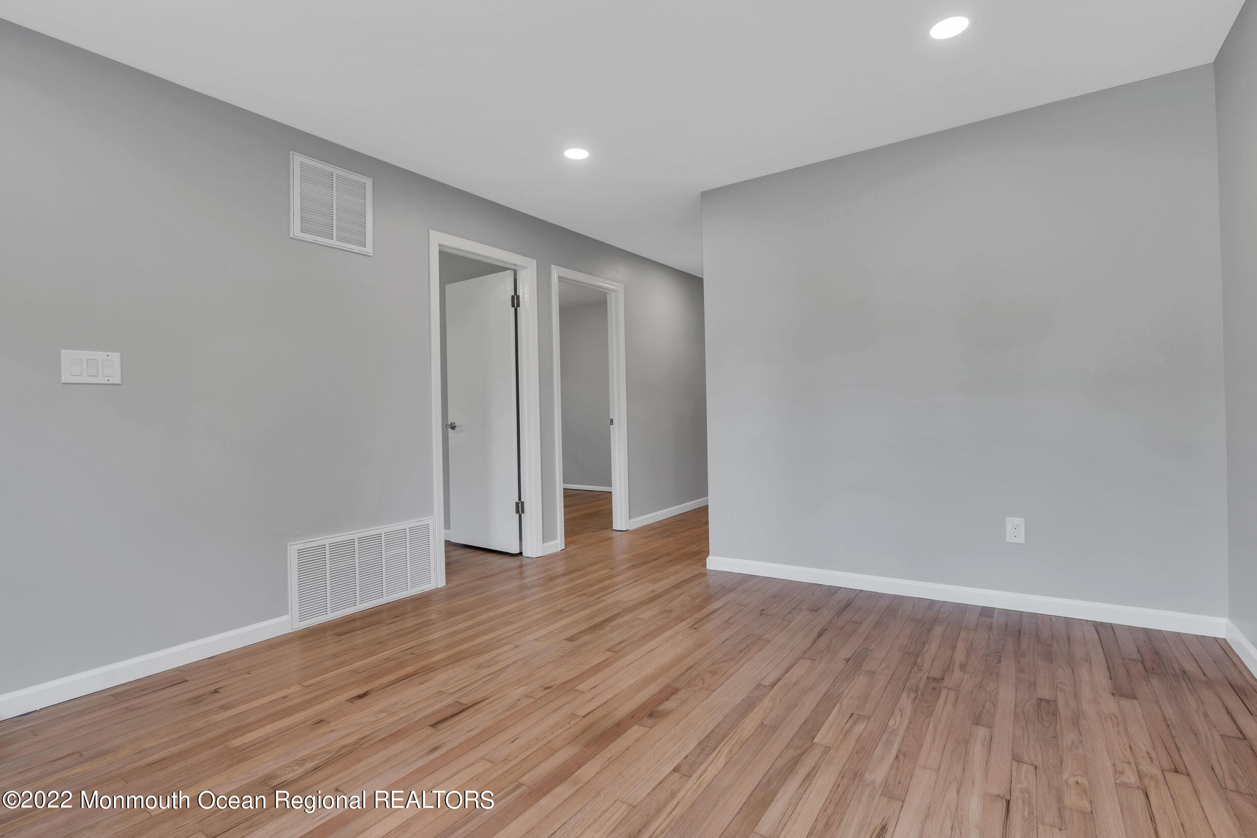 115 West 5th Street Howell, NJ 07731 - Photo 8 of 28 a view of an empty room with wooden floor