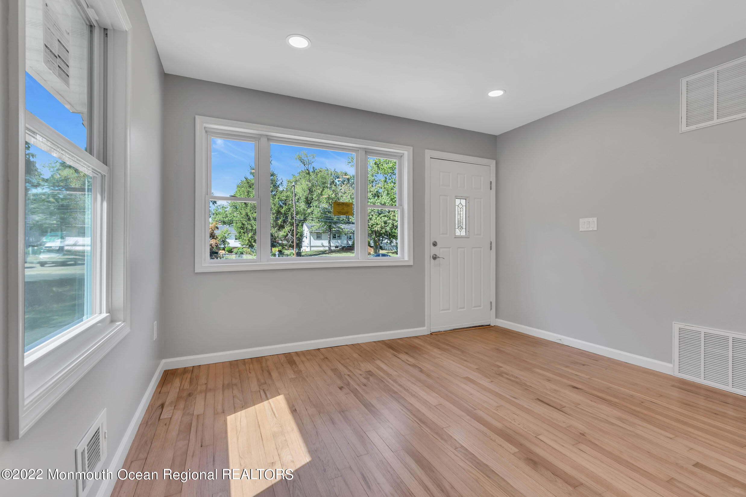 115 West 5th Street Howell, NJ 07731 - Photo 9 of 28 wooden floor in an empty room with a window
