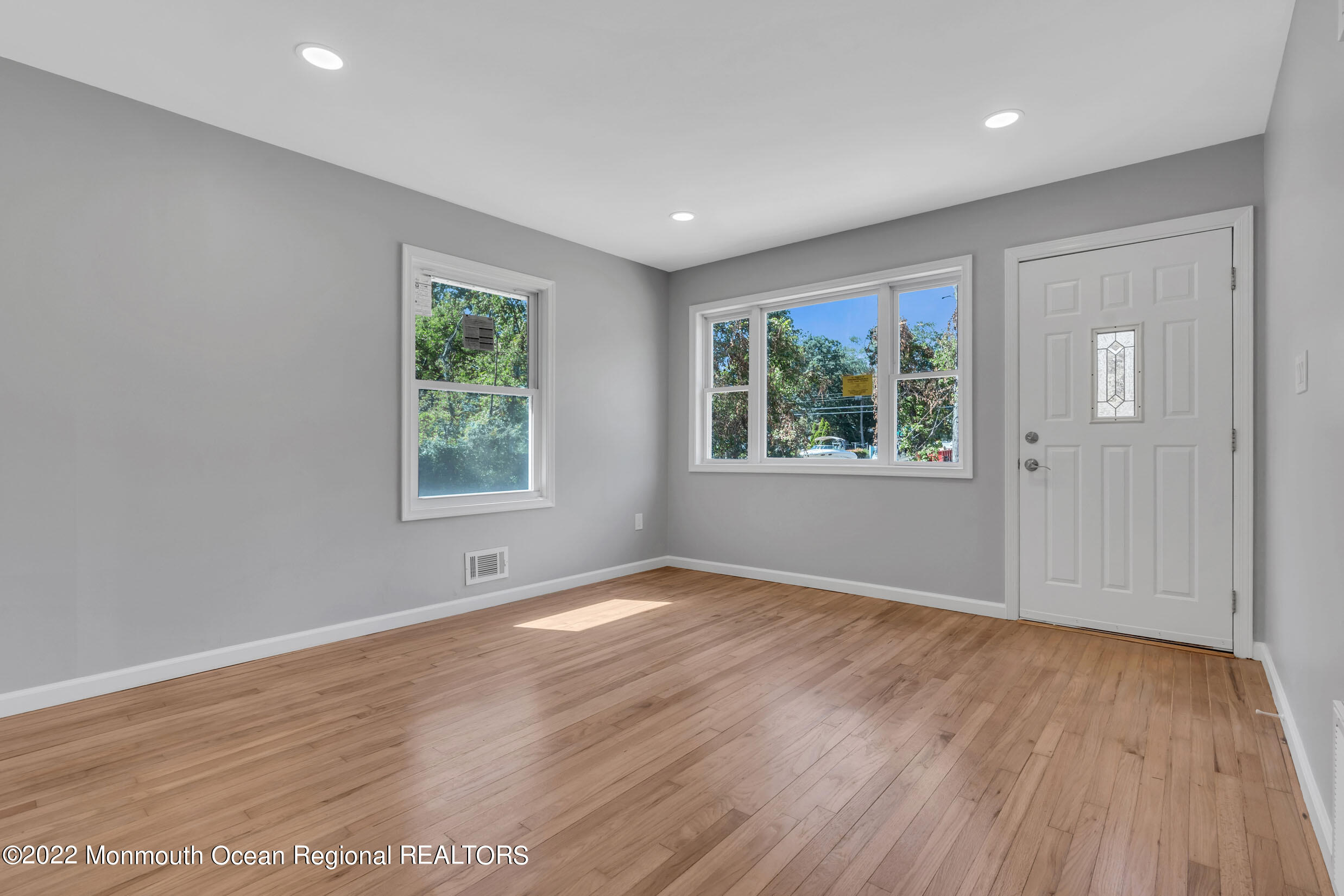 115 West 5th Street Howell, NJ 07731 - Photo 10 of 28 an empty room with wooden floor and windows