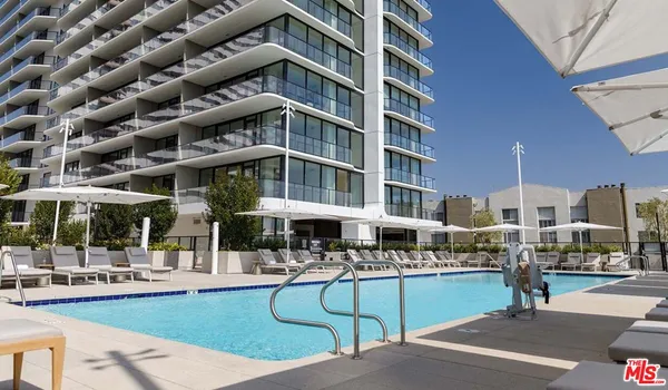 a view of a building with sitting area