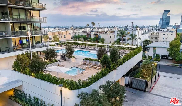 an aerial view of a house with outdoor space