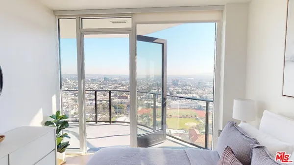 a living room with a large window with outer view