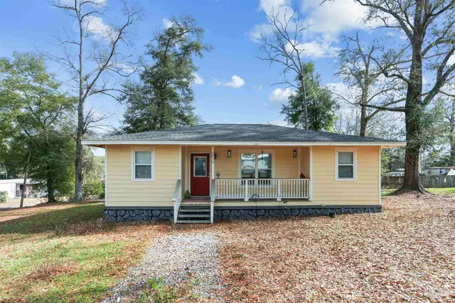 front view of a house with a yard