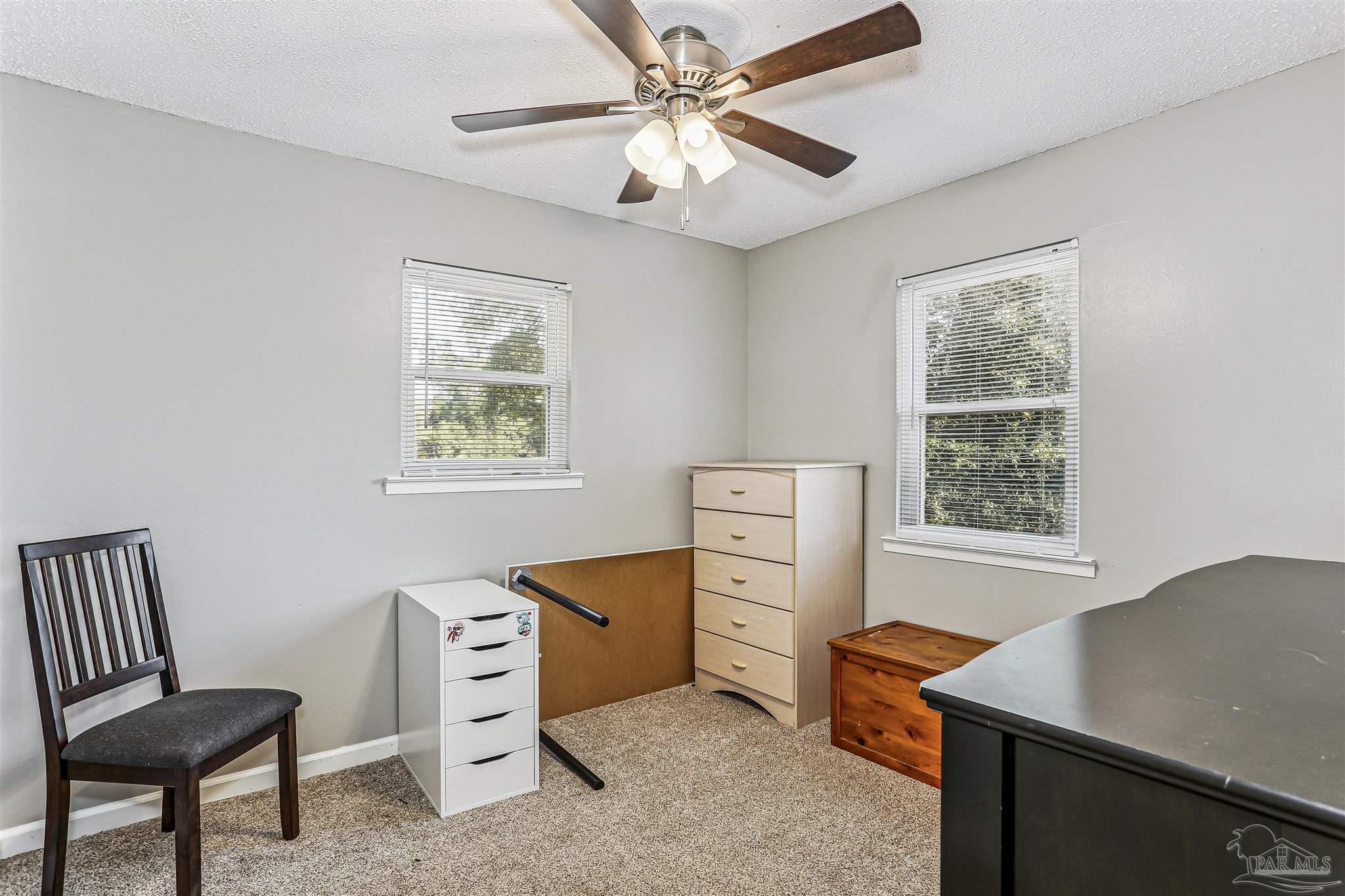 6810 Myra Road Molino, FL 32577 - Photo 19 of 20 a room with furniture and a window
