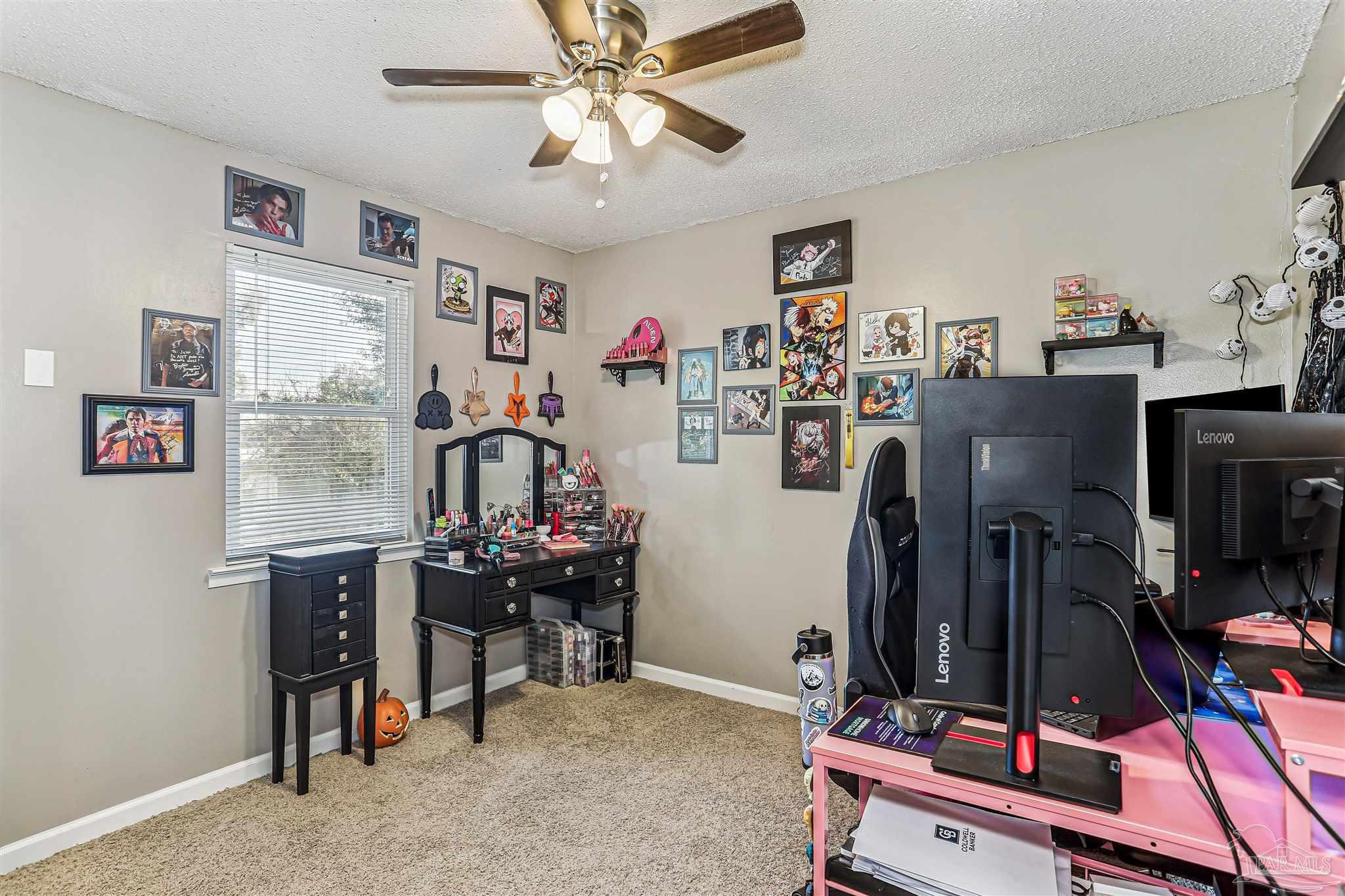6810 Myra Road Molino, FL 32577 - Photo 20 of 20 a view of a room with workspace and music instruments