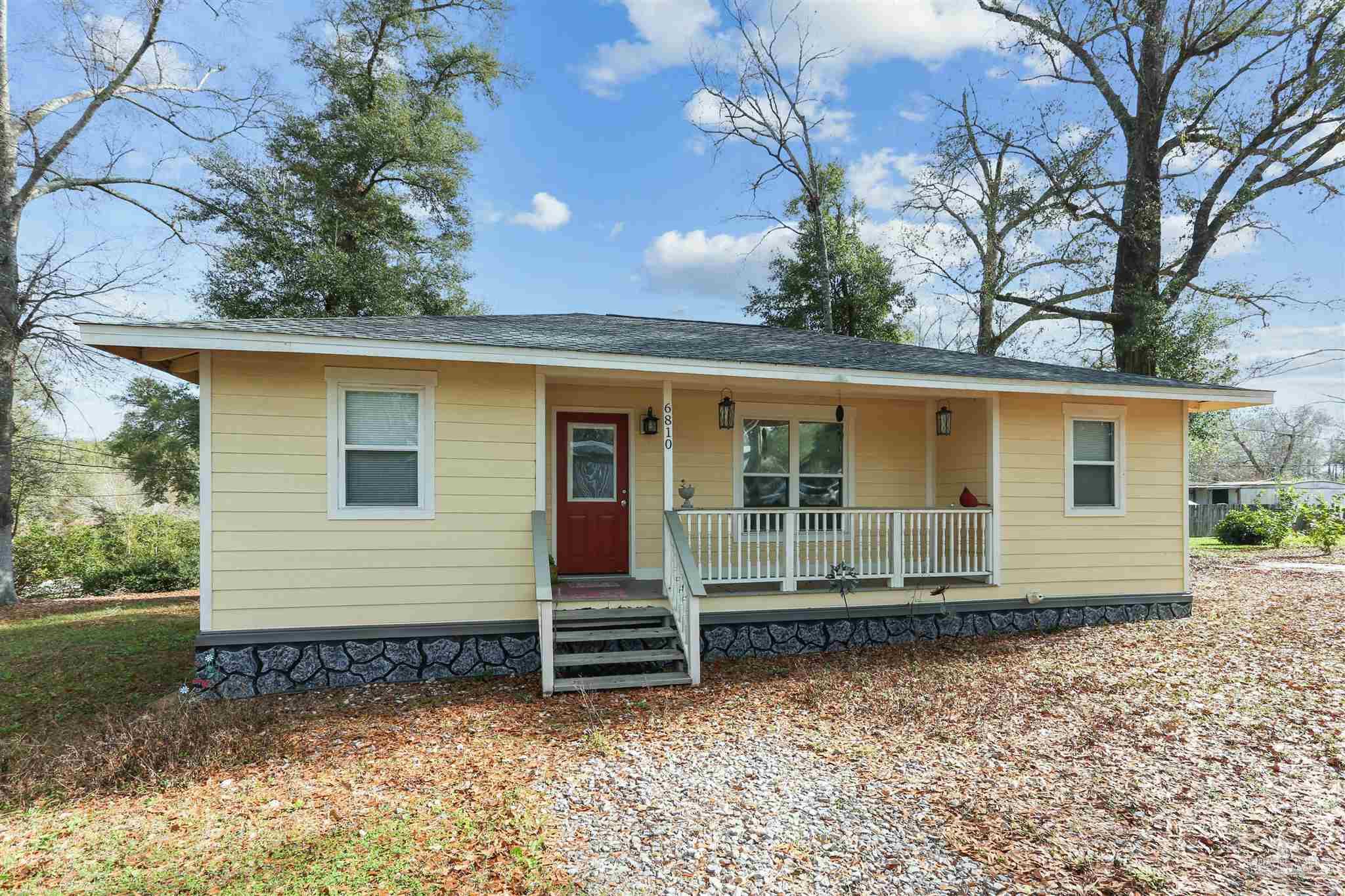 6810 Myra Road Molino, FL 32577 - Photo 3 of 20 front view of a house with a yard