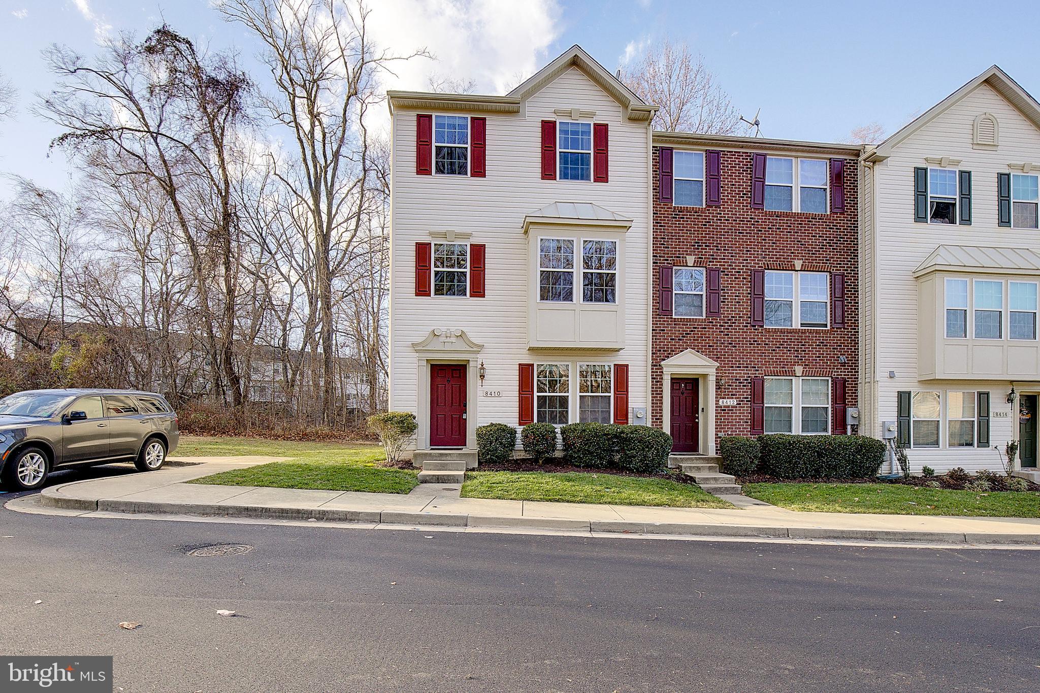 a view of multiple houses with a street