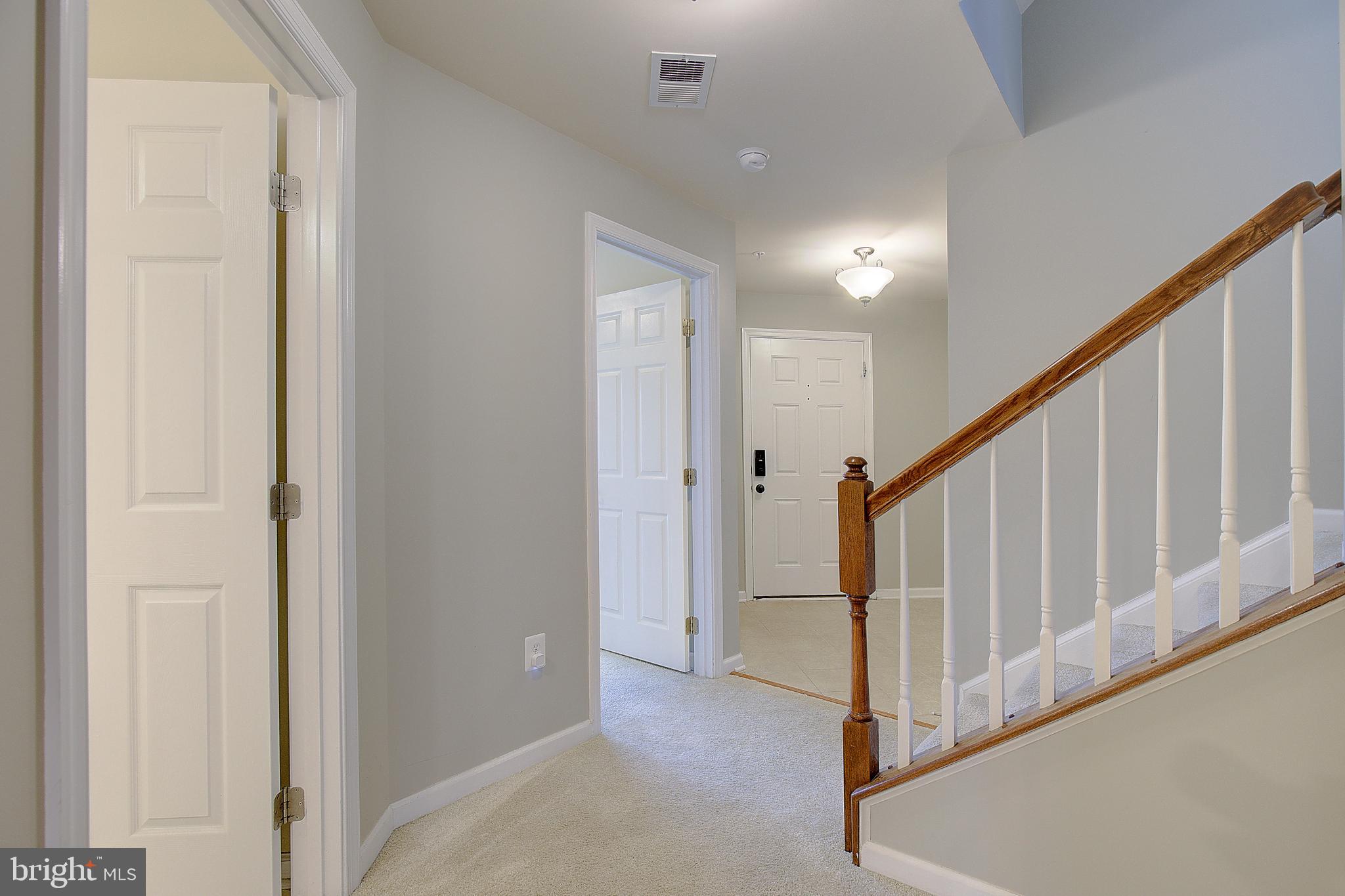 8410 Clear Spring Drive, Unit 1 Chesapeake Beach, MD 20732 - Photo 3 of 41 a view of an entryway with staircase