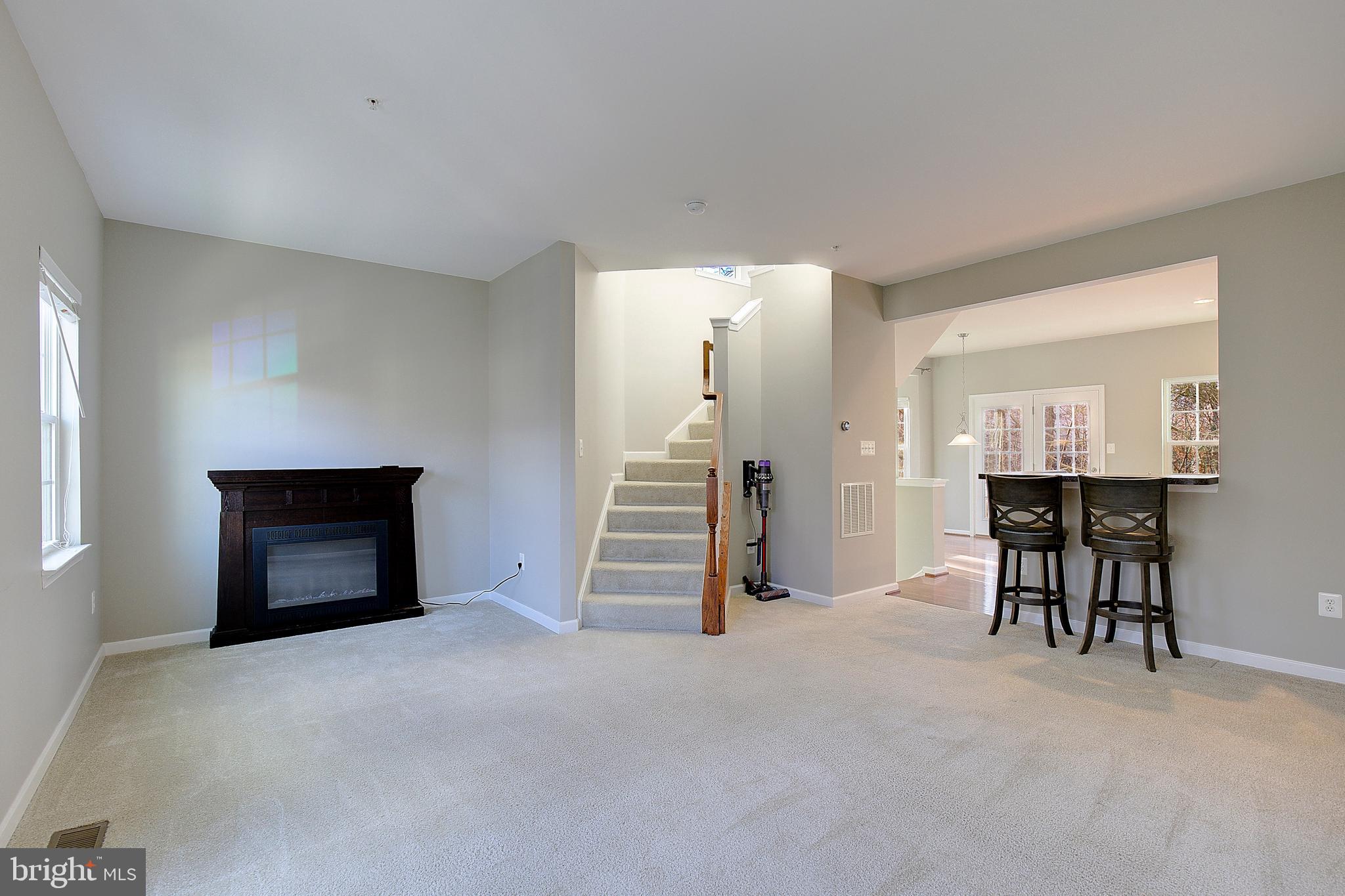 8410 Clear Spring Drive, Unit 1 Chesapeake Beach, MD 20732 - Photo 32 of 41 a view of livingroom with furniture and fireplace