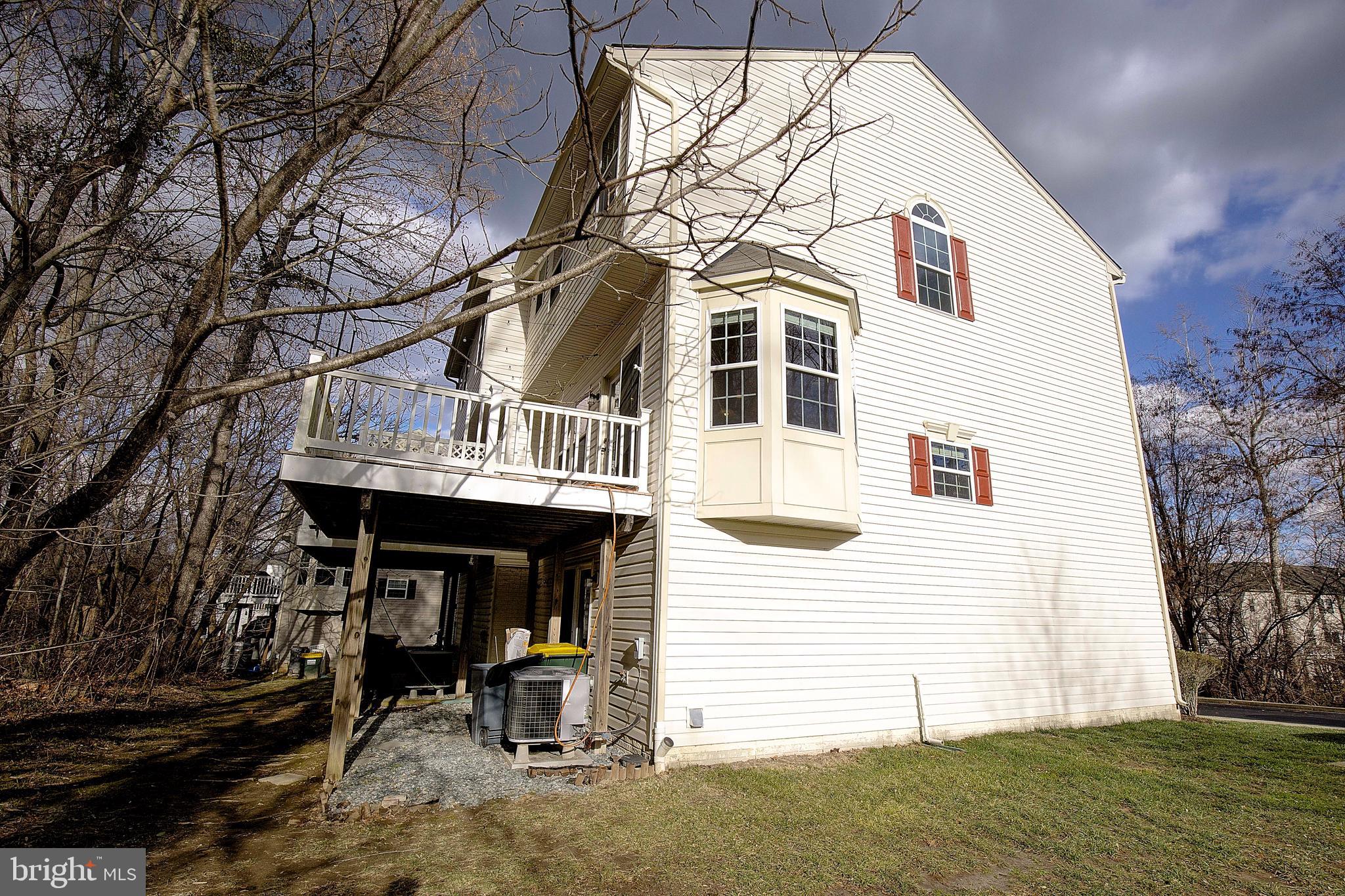 8410 Clear Spring Drive, Unit 1 Chesapeake Beach, MD 20732 - Photo 38 of 41 a front view of a house with garden