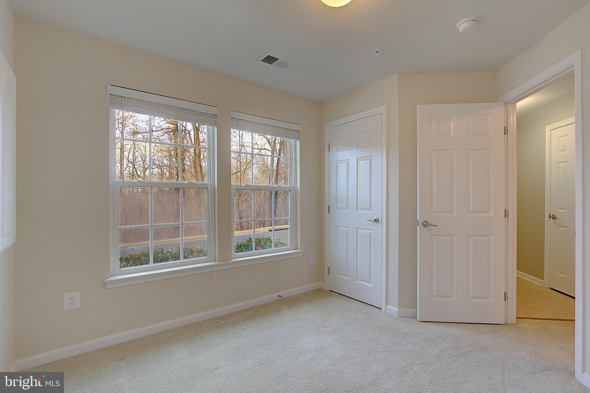 8410 Clear Spring Drive, Unit 1 Chesapeake Beach, MD 20732 - Photo 5 of 41 a view of an empty room with a window