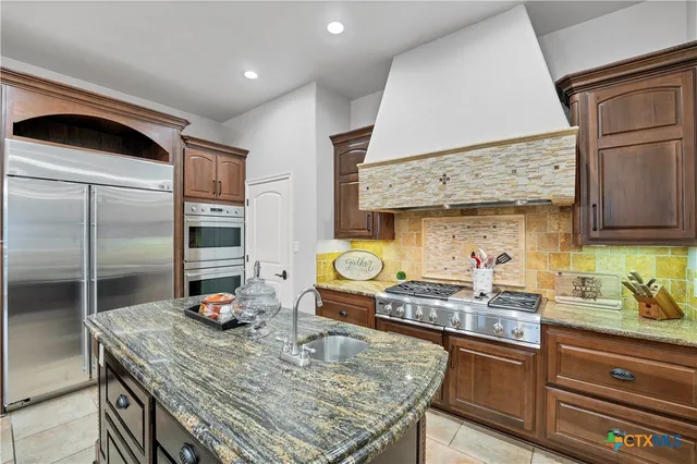 a bedroom with a large bed and a tv