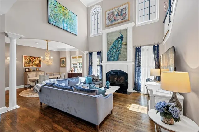a kitchen with stainless steel appliances wooden floor and cabinets