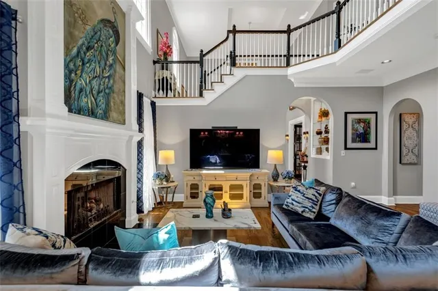 a kitchen with stainless steel appliances kitchen island granite countertop a sink stove and cabinets