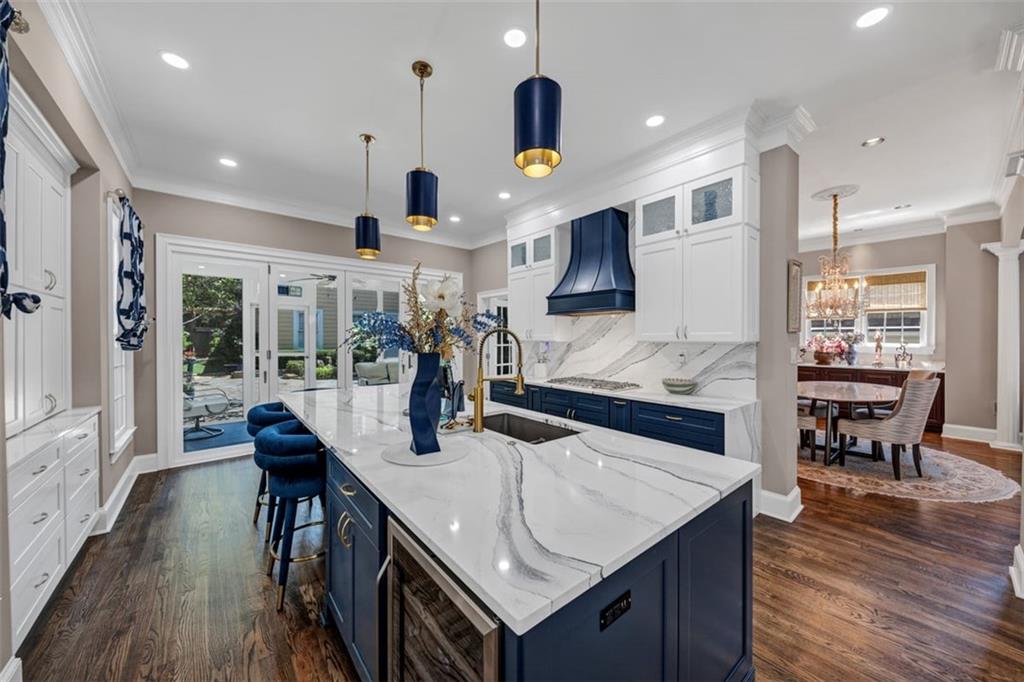 526 Hill Street Southeast Atlanta, GA 30312 - Photo 19 of 81 a kitchen with stainless steel appliances granite countertop a sink a stove and a wooden floors
