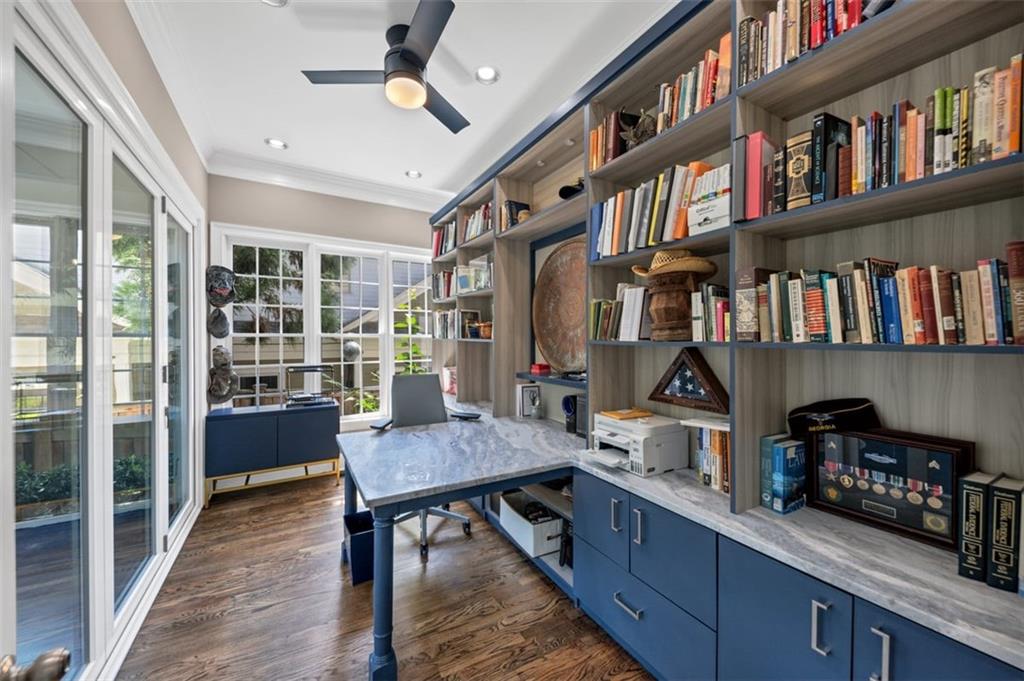 526 Hill Street Southeast Atlanta, GA 30312 - Photo 22 of 81 a room with lots of furniture and a book shelf