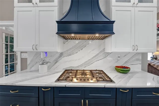 a view of walk in closet with clothes