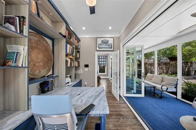 a view of a room with wooden floor window and a ceiling fan