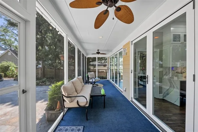 a bathroom with a granite countertop sink mirror toilet and bathtub