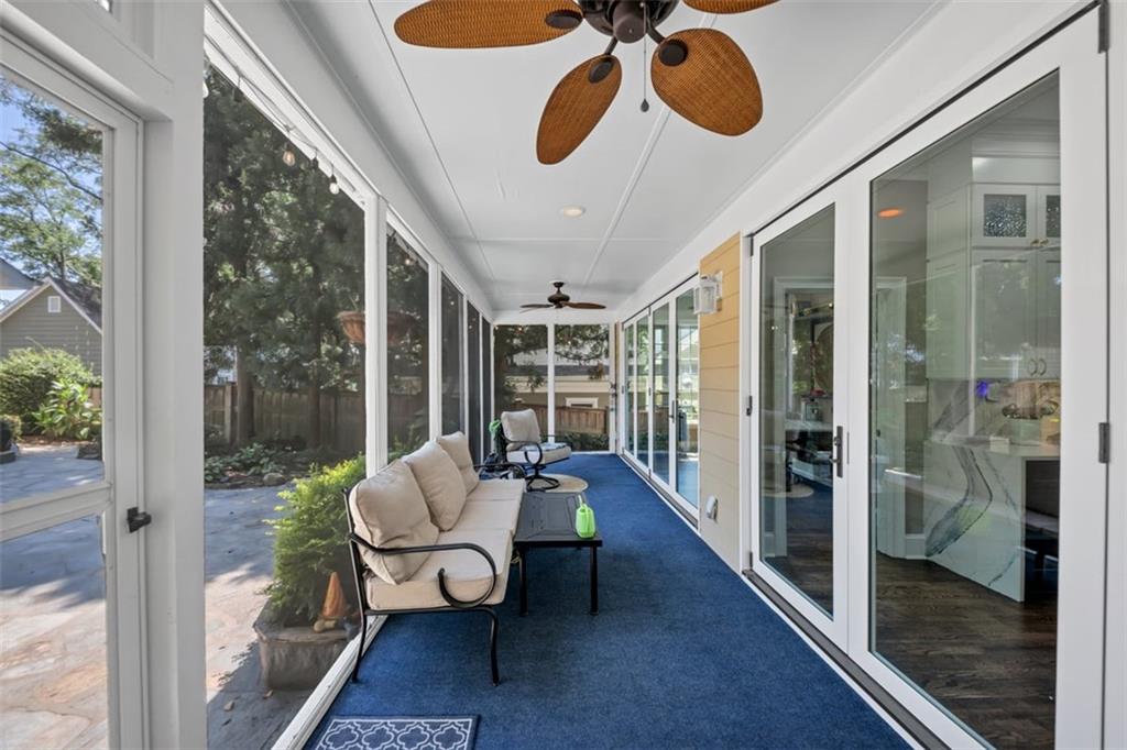 526 Hill Street Southeast Atlanta, GA 30312 - Photo 30 of 81 a living room with furniture and a floor to ceiling window