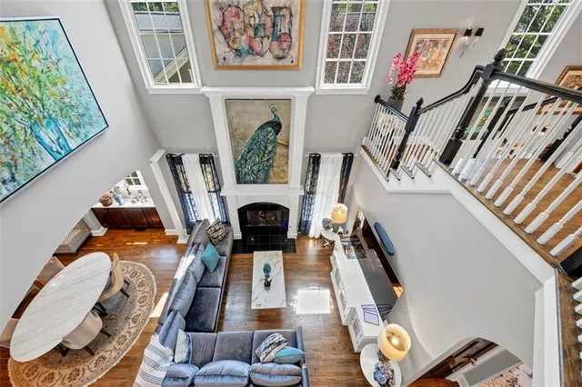 a large bedroom with a bed and a chandelier