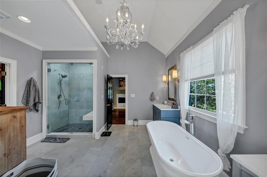 526 Hill Street Southeast Atlanta, GA 30312 - Photo 41 of 81 a spacious bathroom with a granite countertop toilet a sink and a large mirror